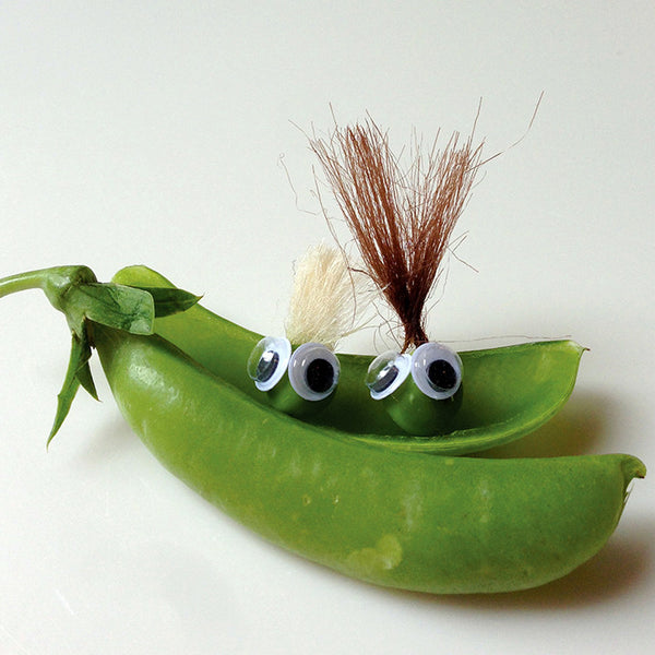 Two pea characters sitting in a pod