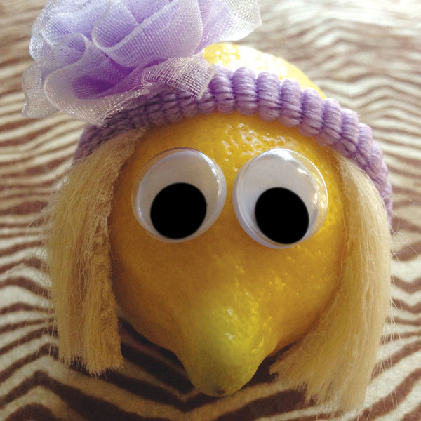 A lemon character with wig and headband