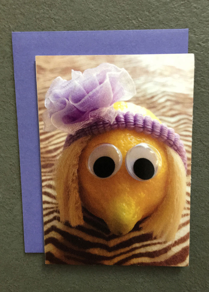 Lemon character with purple headband on gift enclosure card