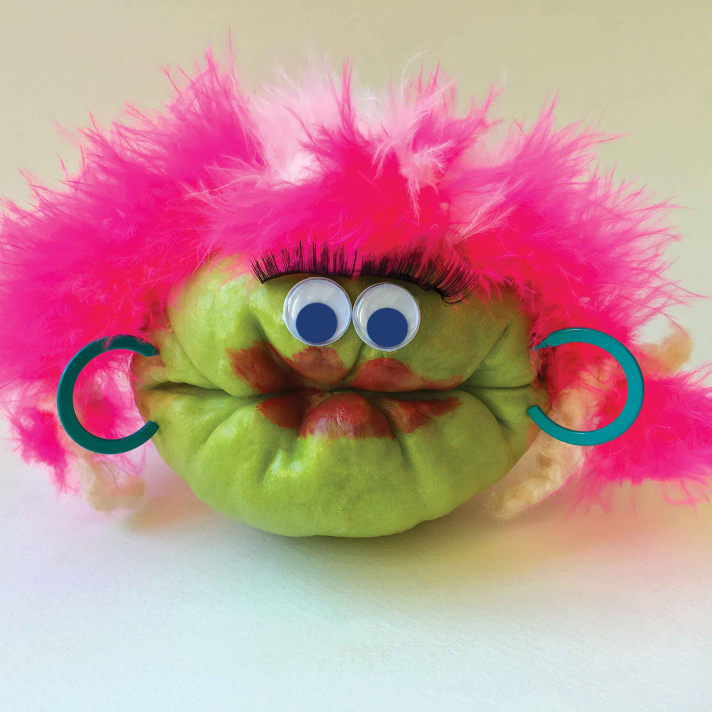 Chayote squash character with pink wig and earrings