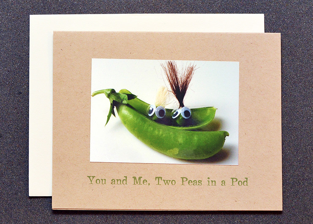 Two pea characters sitting in a pod greeting card