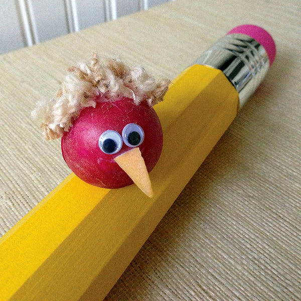 Cute radish character sitting on a yellow pencil